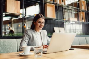 Young businesswoman using laptop.