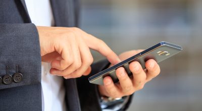 Businessman holding a smartphone