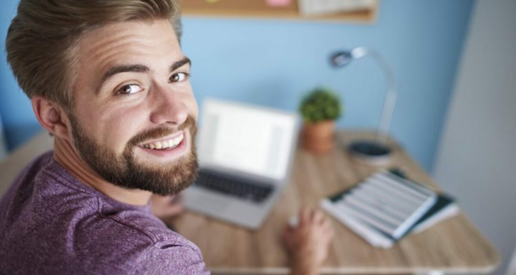 Portrait of man working on the computer